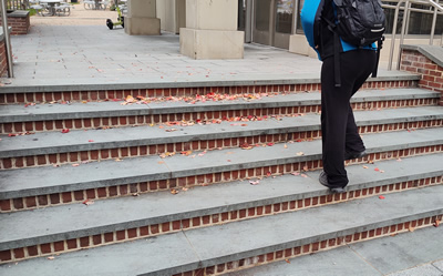 man walking up stairs