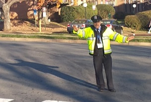 security guard watching over intersection